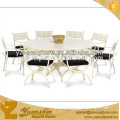 indoor white cast bronze dining table and chair for dinner party